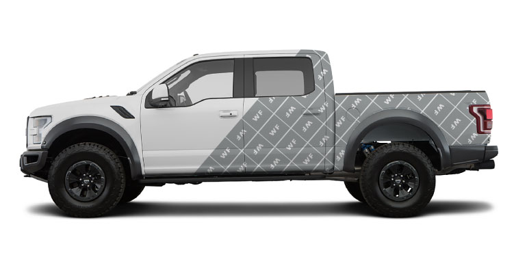 a truck with a half car wrap